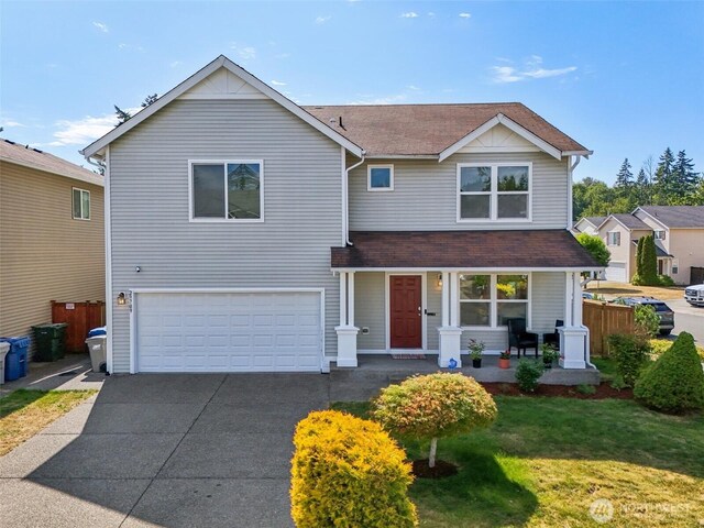 29709 217th Pl SE, Kent, WA 98042 - traditional home with an attached garage, covered porch, concrete driveway, and a shingled roof