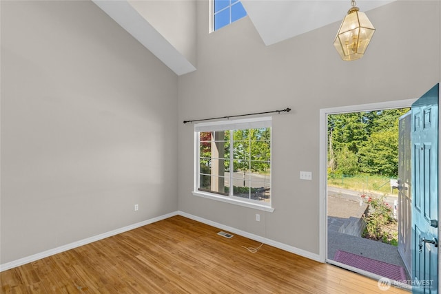26822 27th Ave S, Kent, WA 98032 - foyer featuring a towering ceiling, wood finished floors, and a chandelier