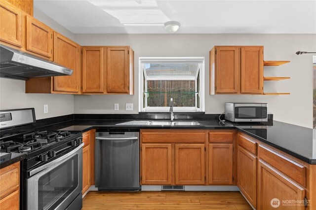26822 27th Ave S, Kent, WA 98032 - kitchen featuring appliances with stainless steel finishes, under cabinet range hood, open shelves, and dark countertops