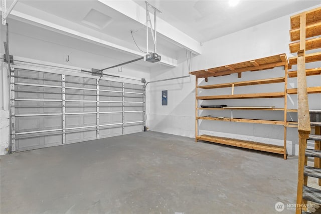 26822 27th Ave S, Kent, WA 98032 - garage featuring electric panel and a garage door opener