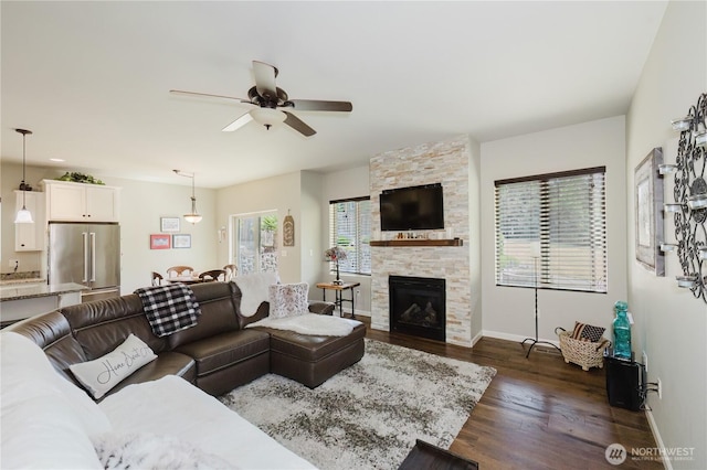 11928 Mayfair Ave SW, Port Orchard, WA 98367 - living room with a ceiling fan, dark wood-type flooring, and a fireplace