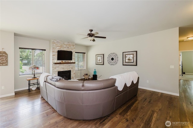 11928 Mayfair Ave SW, Port Orchard, WA 98367 - living room with a ceiling fan, a stone fireplace, and wood finished floors