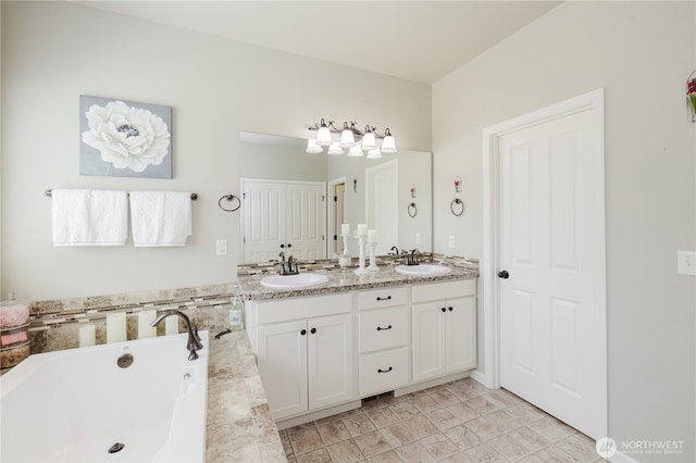 11928 Mayfair Ave SW, Port Orchard, WA 98367 - bathroom with double vanity and a bath