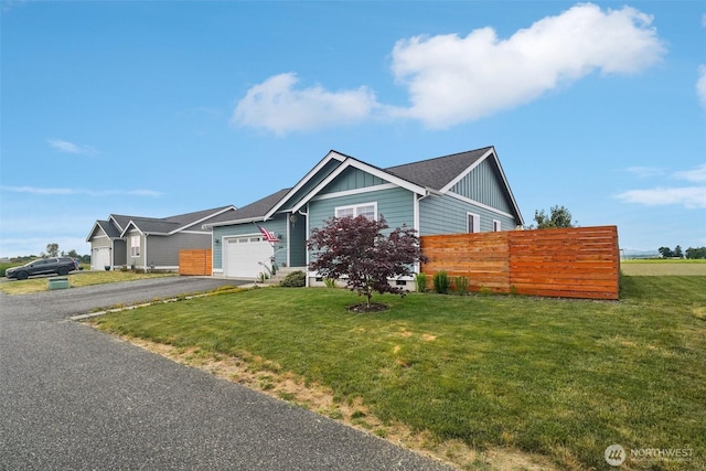 204 Regent Ct, Nooksack, WA 98276 - view of front of property with board and batten siding, driveway, and an attached garage