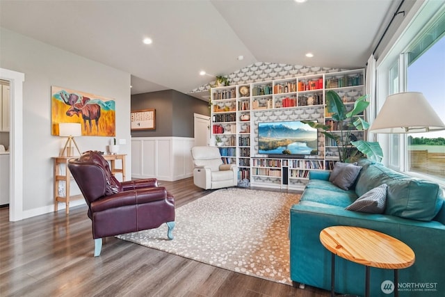 204 Regent Ct, Nooksack, WA 98276 - living room with lofted ceiling, wood finished floors, wainscoting, and washer / dryer
