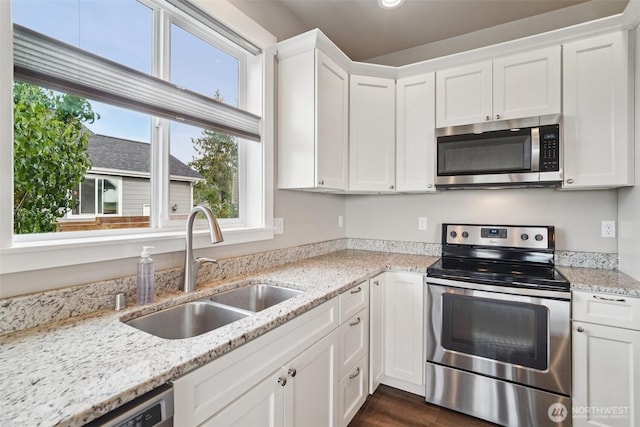 204 Regent Ct, Nooksack, WA 98276 - kitchen with stainless steel appliances, white cabinets, light stone counters, dark wood-style flooring, and recessed lighting