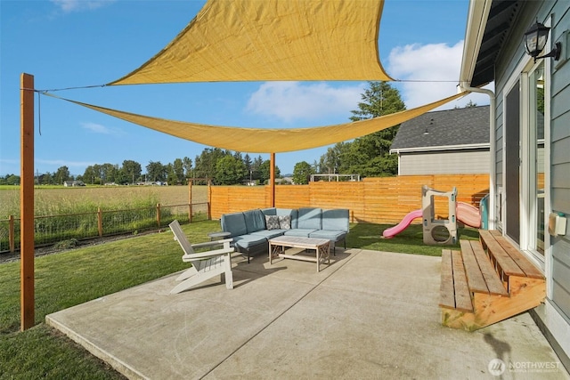 204 Regent Ct, Nooksack, WA 98276 - fenced backyard with an outdoor hangout area and a patio area
