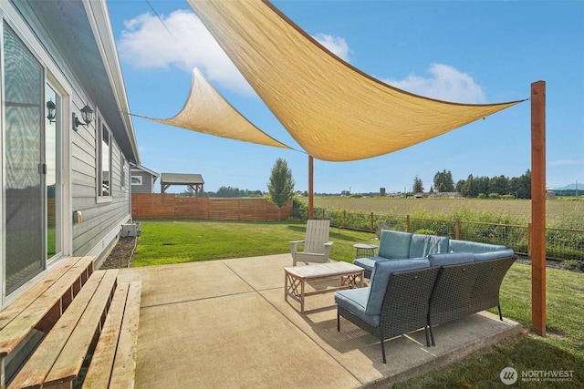 204 Regent Ct, Nooksack, WA 98276 - fenced backyard featuring an outdoor living space and a patio area