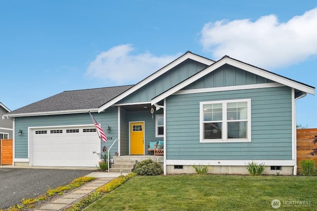 204 Regent Ct, Nooksack, WA 98276 - view of front of property with an attached garage, driveway, a front yard, board and batten siding, and a shingled roof