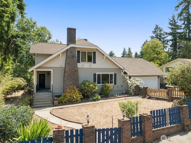 13016 8th Pl SW, Burien, WA 98146 - view of front of home with a fenced front yard, a chimney, a garage, a gate, and a shingled roof