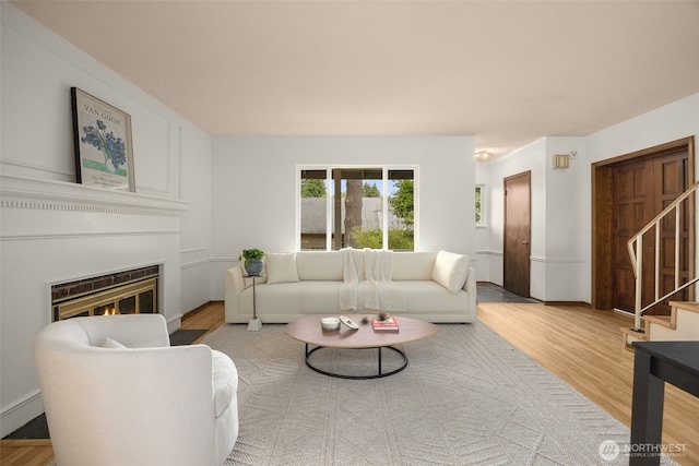 13016 8th Pl SW, Burien, WA 98146 - living room with wood finished floors, stairway, and a glass covered fireplace