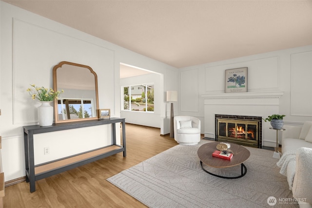 13016 8th Pl SW, Burien, WA 98146 - living room featuring wood finished floors and a fireplace with flush hearth