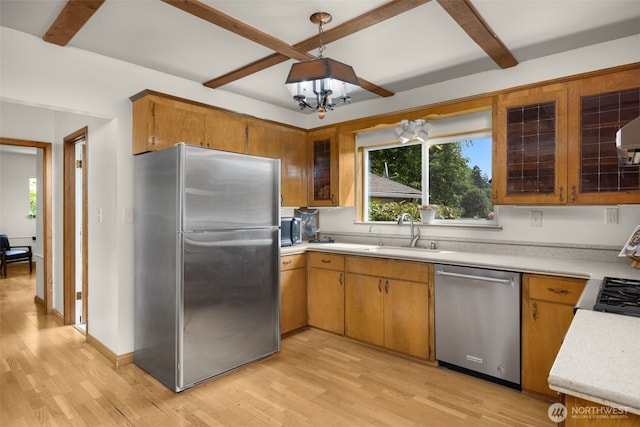 13016 8th Pl SW, Burien, WA 98146 - kitchen with appliances with stainless steel finishes, light wood finished floors, light countertops, a chandelier, and beam ceiling