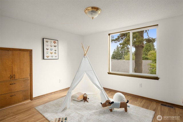 13016 8th Pl SW, Burien, WA 98146 - playroom featuring wood finished floors and baseboards