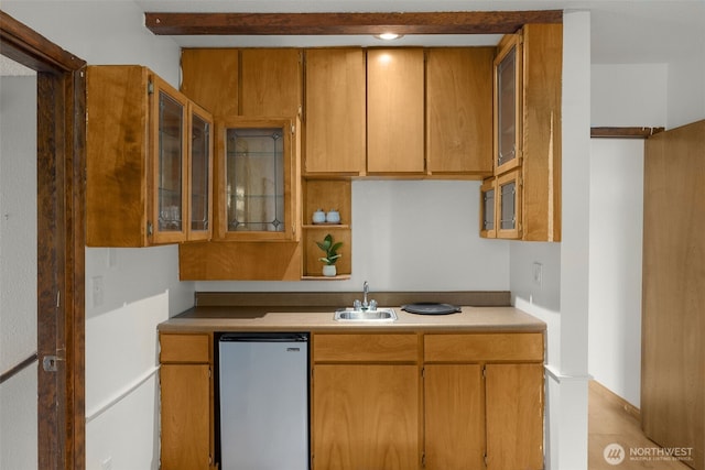 13016 8th Pl SW, Burien, WA 98146 - kitchen with stainless steel fridge, glass insert cabinets, light countertops, and brown cabinets