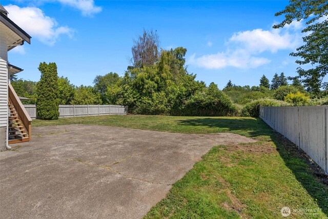29260 Military Rd S, Federal Way, WA 98003 - fenced backyard featuring a patio and stairway