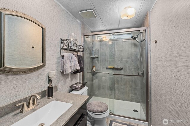 45019 Cougi Dr N, Davenport, WA 99122 - full bathroom with vanity, a shower stall, and a textured ceiling