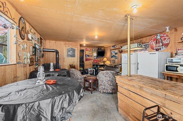45019 Cougi Dr N, Davenport, WA 99122 - dining space with wooden walls and unfinished concrete floors