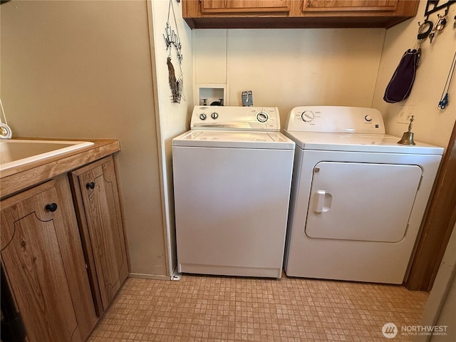 45019 Cougi Dr N, Davenport, WA 99122 - laundry area with cabinet space and independent washer and dryer