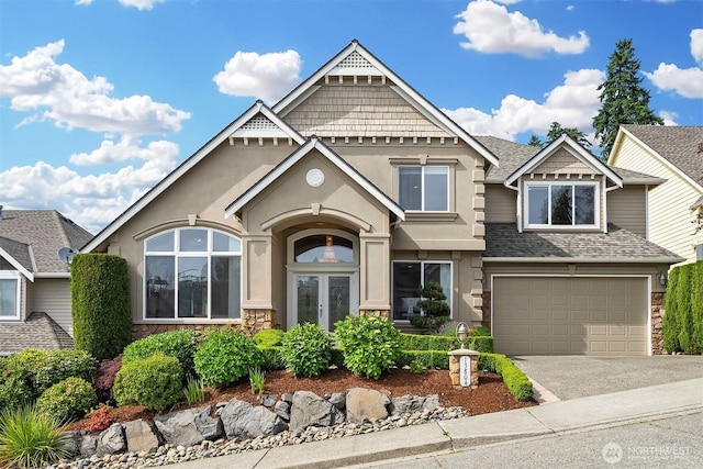 13804 SE 76th Pl, Newcastle, WA 98059 - craftsman inspired home featuring french doors, a garage, driveway, and stone siding
