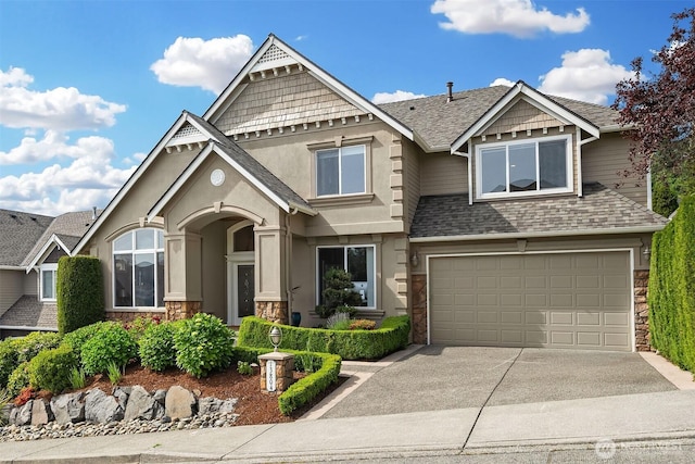 13804 SE 76th Pl, Newcastle, WA 98059 - view of front facade featuring an attached garage, concrete driveway, stone siding, roof with shingles, and stucco siding