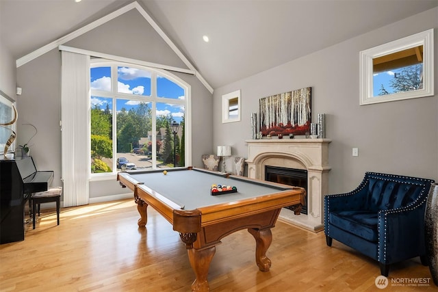 13804 SE 76th Pl, Newcastle, WA 98059 - rec room featuring a fireplace with raised hearth, billiards table, light wood-type flooring, and vaulted ceiling