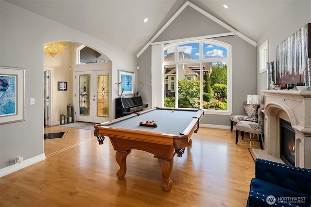 13804 SE 76th Pl, Newcastle, WA 98059 - playroom with light wood finished floors, billiards table, high vaulted ceiling, and a fireplace
