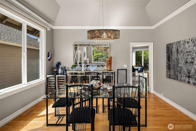 13804 SE 76th Pl, Newcastle, WA 98059 - dining area with vaulted ceiling, wood finished floors, a chandelier, and ornamental molding