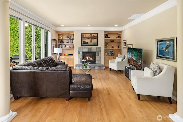 13804 SE 76th Pl, Newcastle, WA 98059 - living area featuring a stone fireplace, light wood-style flooring, ornamental molding, built in features, and recessed lighting