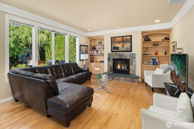 13804 SE 76th Pl, Newcastle, WA 98059 - living room featuring healthy amount of natural light, ornamental molding, light wood finished floors, a fireplace, and built in shelves