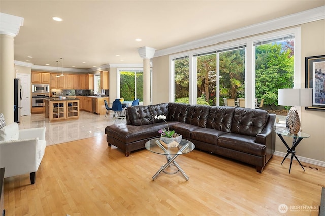13804 SE 76th Pl, Newcastle, WA 98059 - living area featuring ornate columns, ornamental molding, light wood-type flooring, and recessed lighting