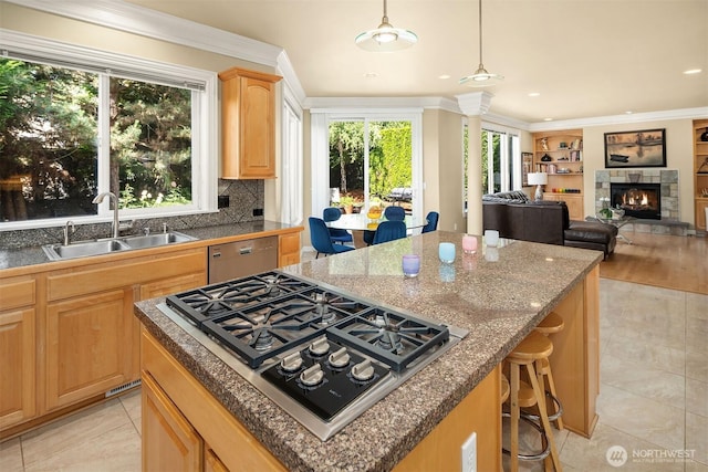 13804 SE 76th Pl, Newcastle, WA 98059 - kitchen featuring stainless steel appliances, a kitchen island, light brown cabinetry, plenty of natural light, and crown molding