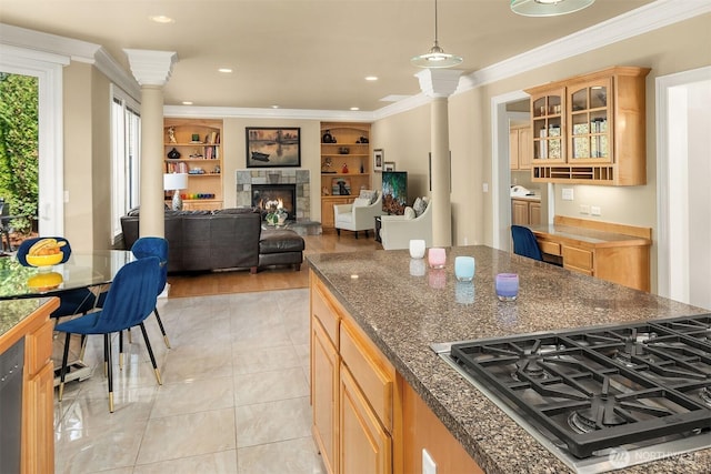 13804 SE 76th Pl, Newcastle, WA 98059 - kitchen with stainless steel gas cooktop, ornate columns, glass insert cabinets, a tiled fireplace, and light brown cabinetry