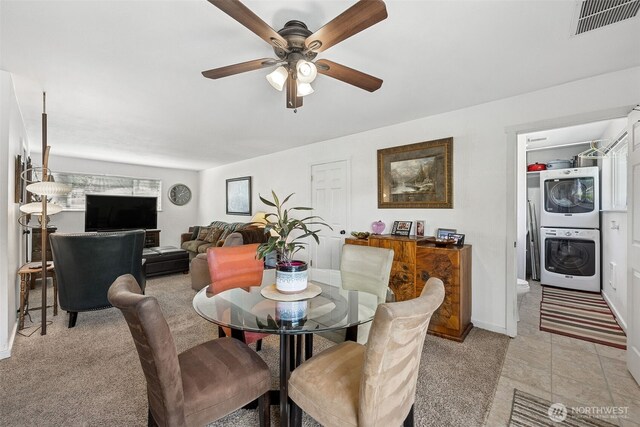 1227 137th St E, Tacoma, WA 98445 - dining space with stacked washer and clothes dryer and ceiling fan