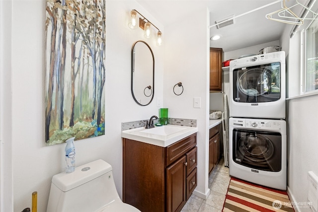 1227 137th St E, Tacoma, WA 98445 - laundry room with stacked washing machine and dryer