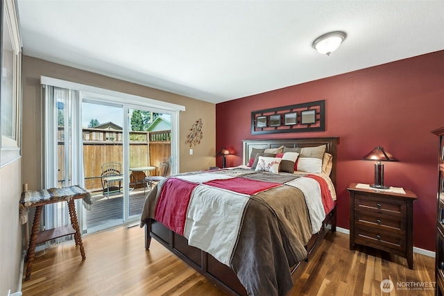 1227 137th St E, Tacoma, WA 98445 - bedroom with access to exterior and wood finished floors