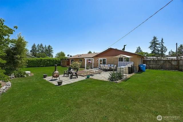 1227 137th St E, Tacoma, WA 98445 - rear view of house with a patio and an outdoor living space