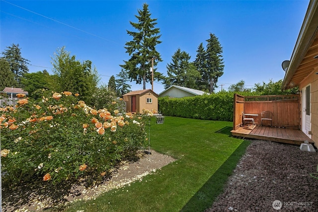 1227 137th St E, Tacoma, WA 98445 - view of yard with a storage shed and a wooden deck