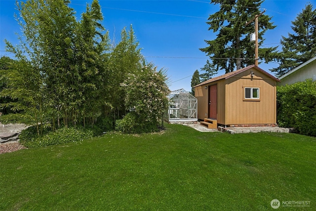 1227 137th St E, Tacoma, WA 98445 - view of green lawn featuring an outbuilding and an exterior structure
