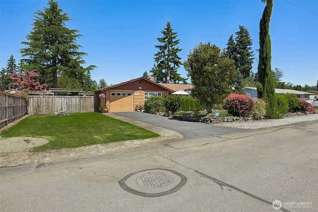 1227 137th St E, Tacoma, WA 98445 - view of front of home with driveway and a garage