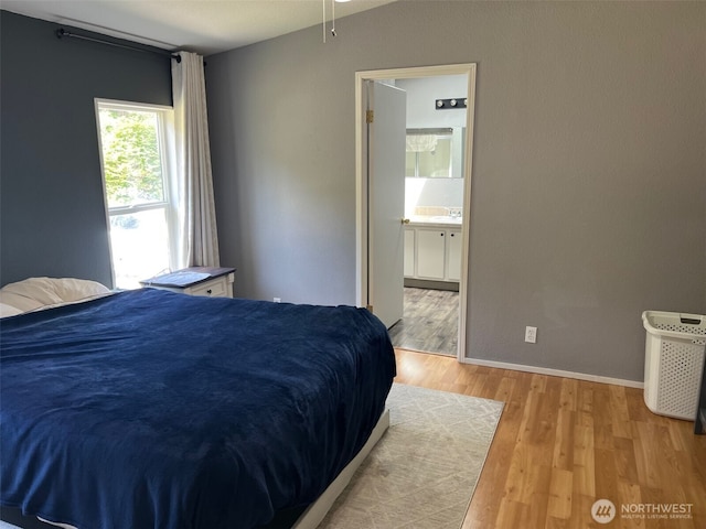 29306 O St, Ocean Park, WA 98640 - bedroom featuring light wood-type flooring and connected bathroom