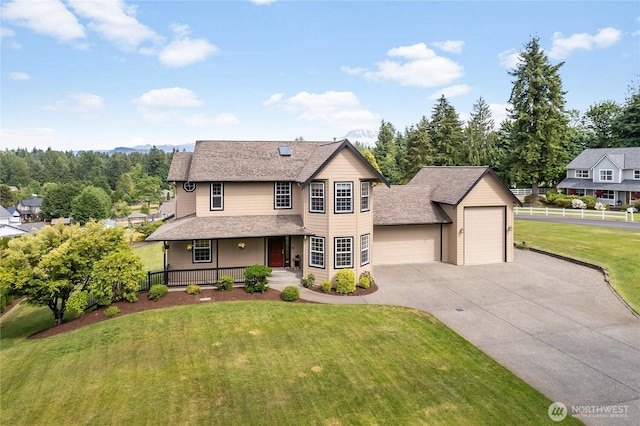 23017 138th Ave E, Graham, WA 98338 - traditional-style home with a porch, driveway, roof with shingles, and a garage