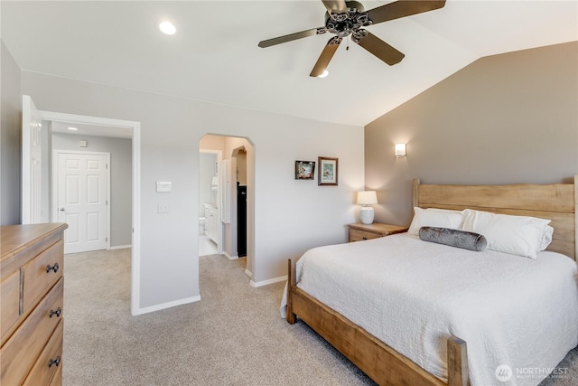 23017 138th Ave E, Graham, WA 98338 - bedroom with arched walkways, vaulted ceiling, light carpet, recessed lighting, and ensuite bath