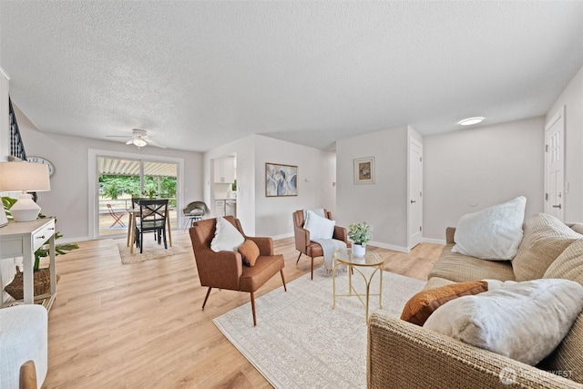5257 N Dahl Dr, Tacoma, WA 98406 - living room featuring a textured ceiling, light wood-style flooring, and a ceiling fan