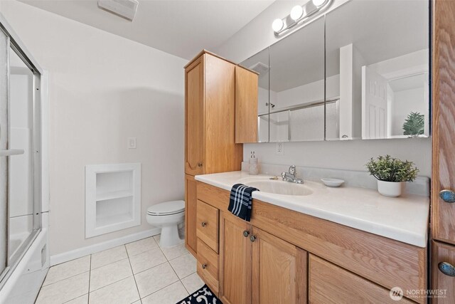 5257 N Dahl Dr, Tacoma, WA 98406 - bathroom featuring vanity, tile patterned floors, and bath / shower combo with glass door
