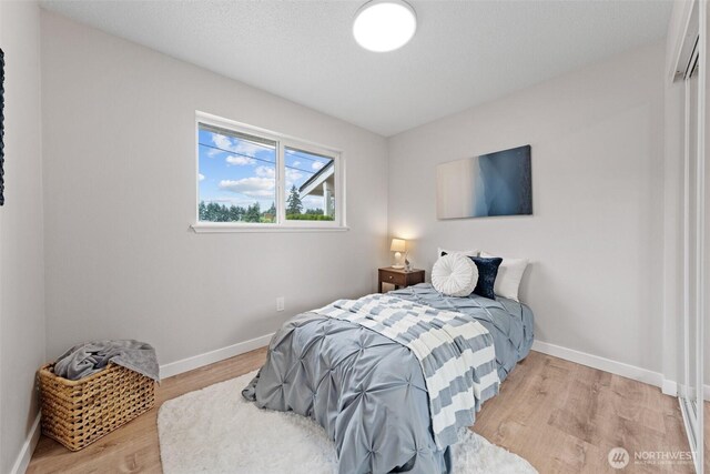 5257 N Dahl Dr, Tacoma, WA 98406 - bedroom with light wood-type flooring and baseboards