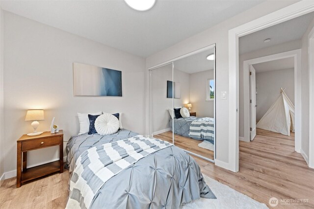 5257 N Dahl Dr, Tacoma, WA 98406 - bedroom with light wood-style floors and a closet