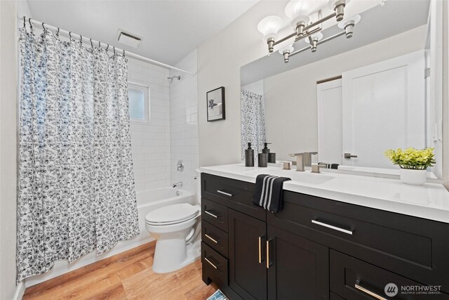 5257 N Dahl Dr, Tacoma, WA 98406 - bathroom featuring vanity, wood finished floors, shower / tub combo, and a chandelier