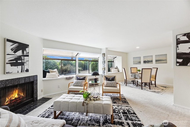 150 Melrose Ave E Unit 105, Seattle, WA 98102 - carpeted living area featuring a tiled fireplace and baseboards