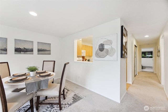 150 Melrose Ave E Unit 105, Seattle, WA 98102 - dining area with light colored carpet and recessed lighting
